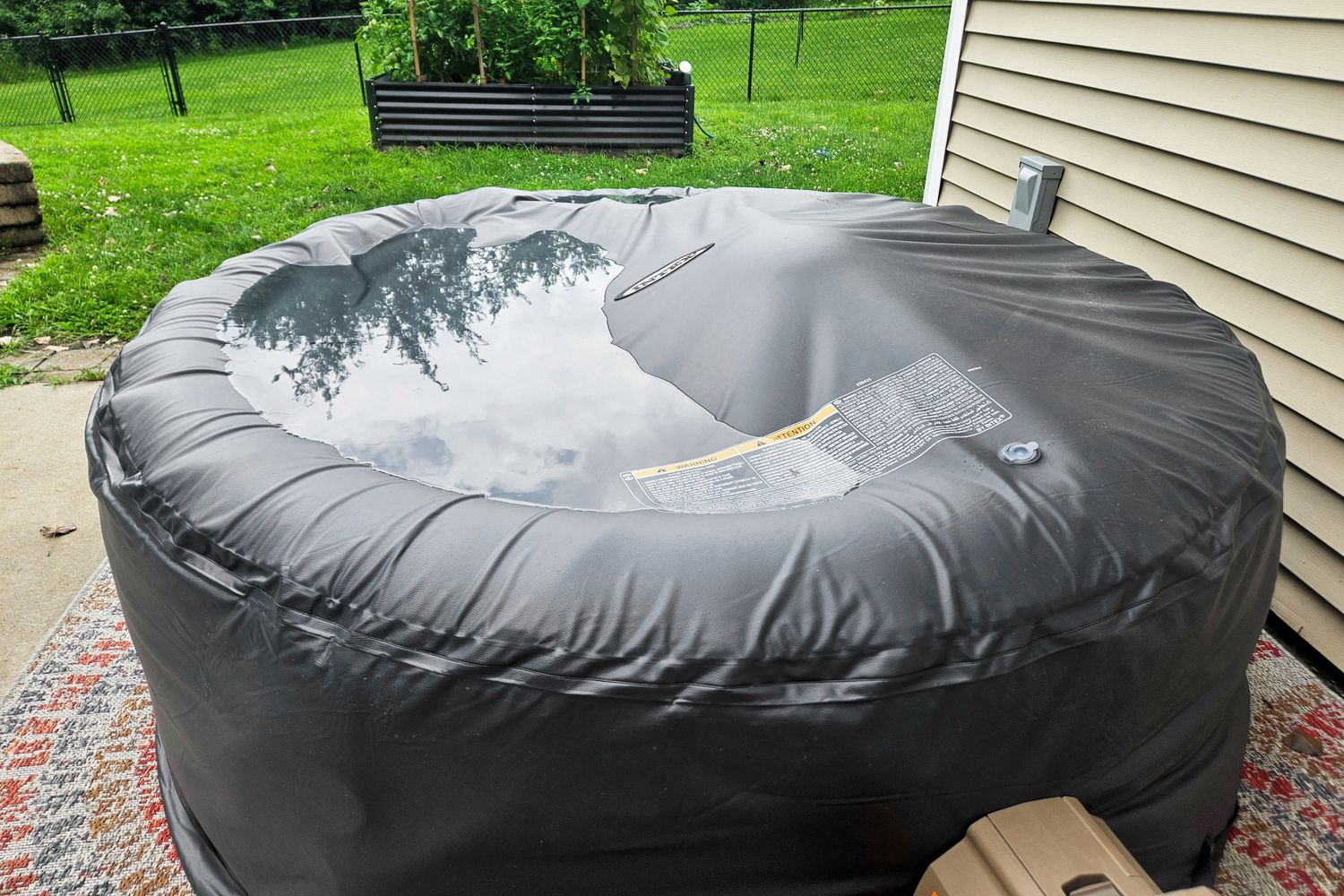 Lid of hot tub with water on top